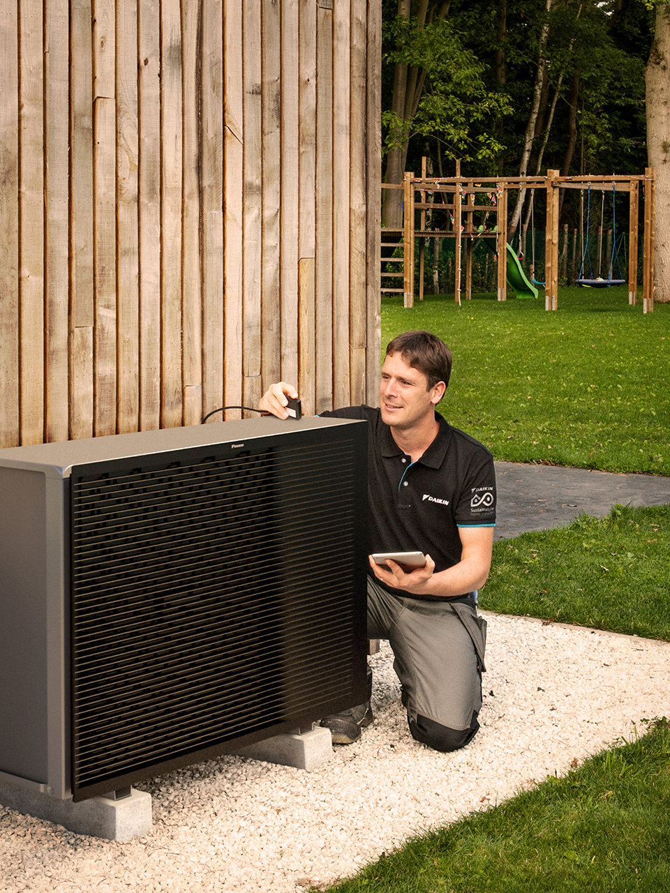 An installer installing an outdoor unit