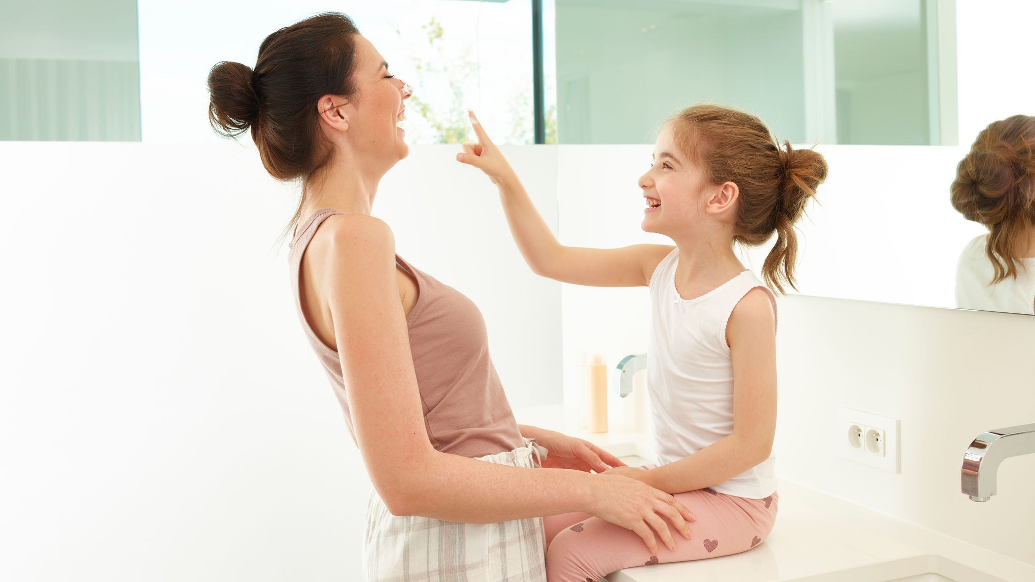 Mother and her daughter playing 
